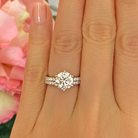 1.5 ctw Pear Accented Solitaire Ring