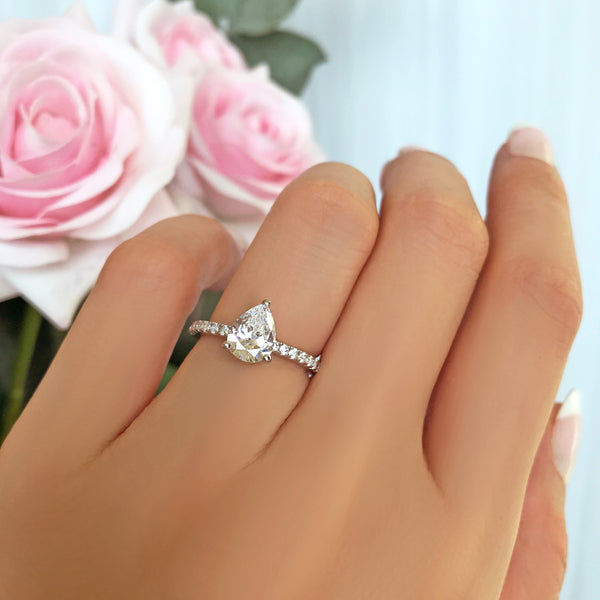 1.5 ctw Pear Accented Solitaire Ring