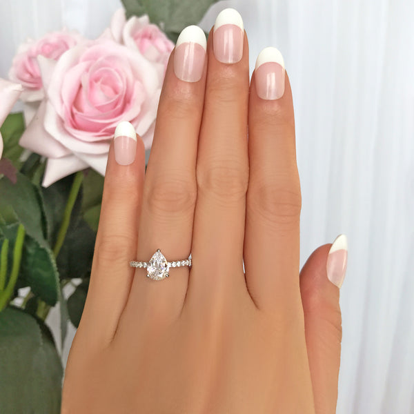 1.5 ctw Pear Accented Solitaire Ring