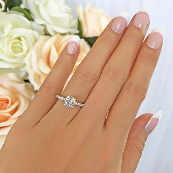 1.25 ctw Round Accented Solitaire Ring