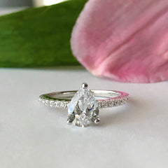 1.5 ctw Pear Accented Solitaire Ring