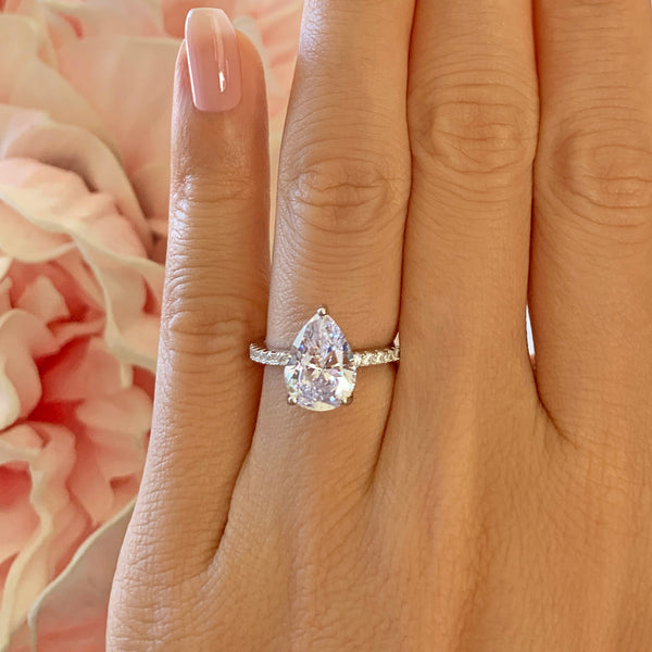 3.25 ctw Pear Accented Solitaire Ring