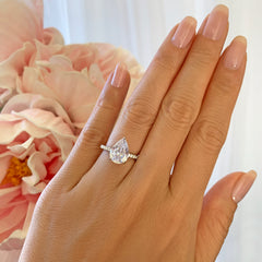 3.25 ctw Pear Accented Solitaire Ring