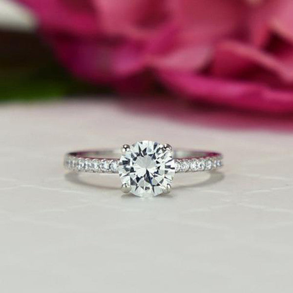 1.25 ctw Round Accented Solitaire Ring